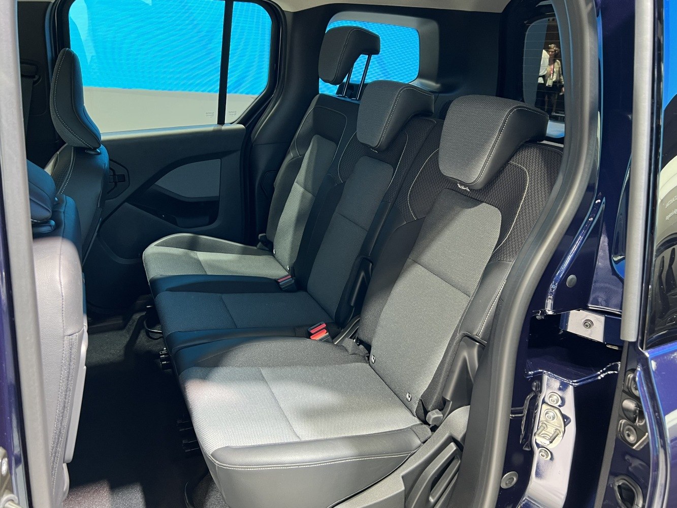 Rear passenger seating with three seats and headrests