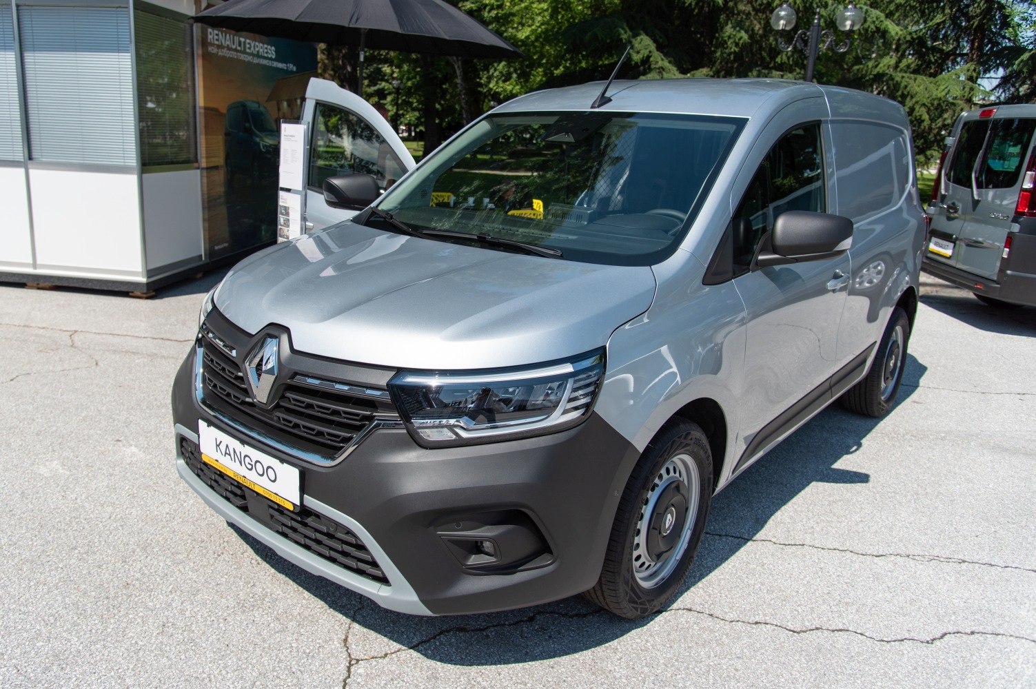 front view of compact light commercial van with black grille and modern headlights