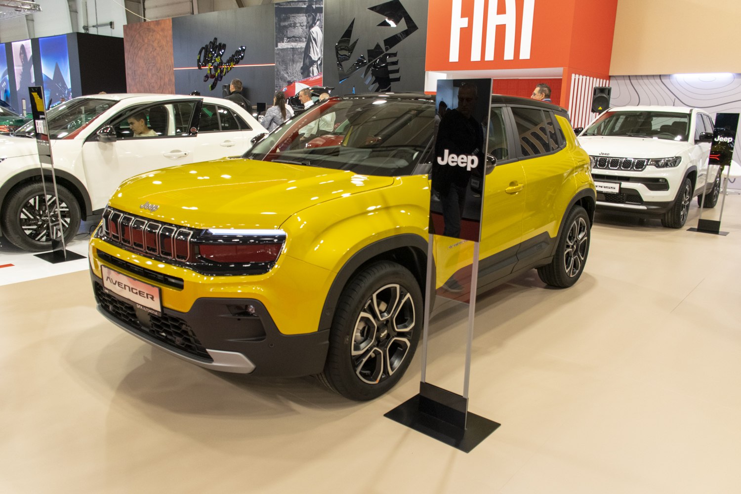 Yellow SUV with modern grille and bold alloy wheels.