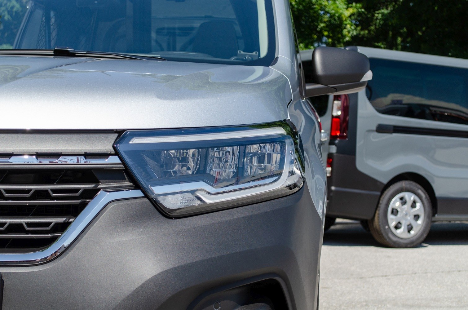 Close-up of front headlight and grille design.