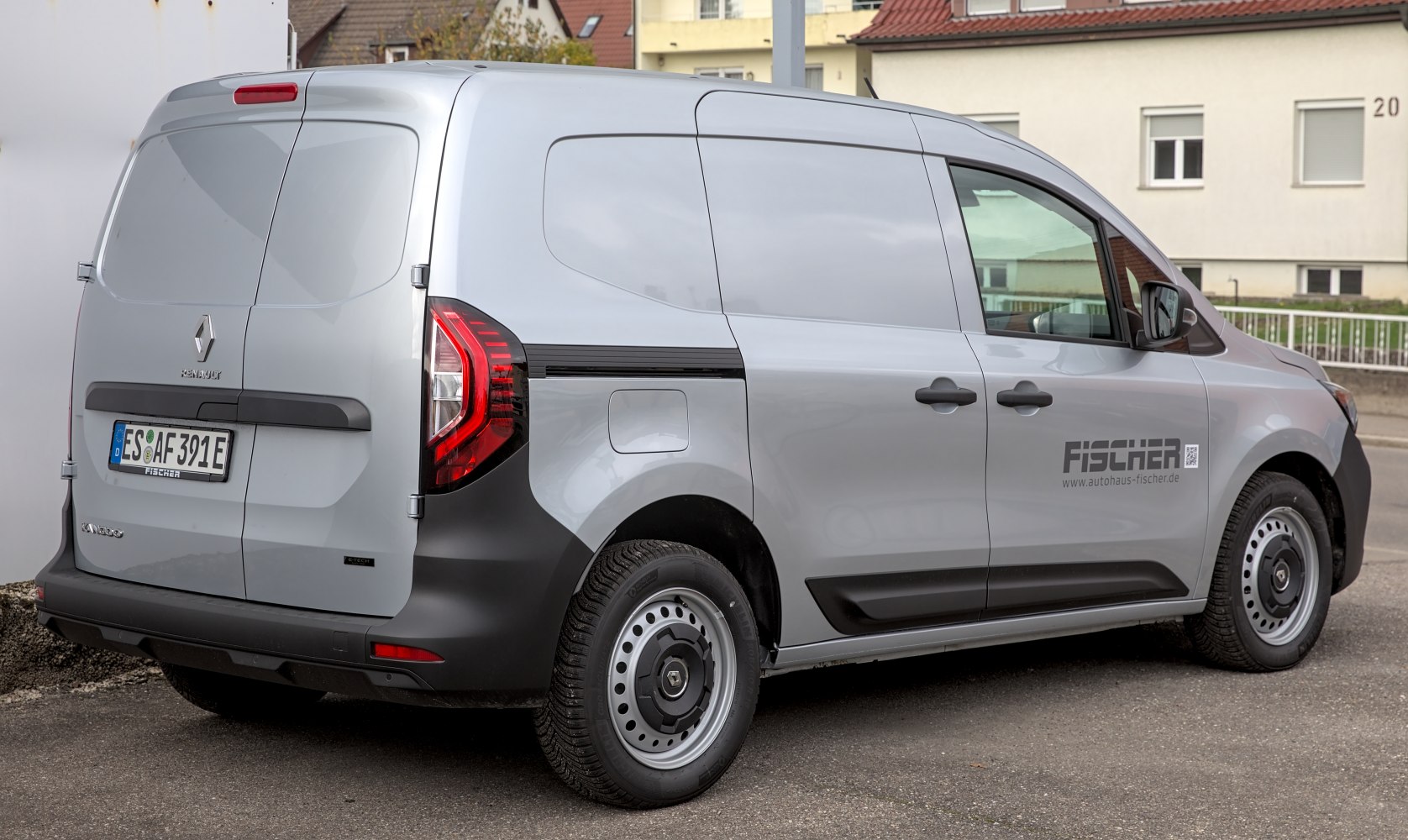 Modern light commercial van rear and side panels with steel wheels and black plastic bumpers