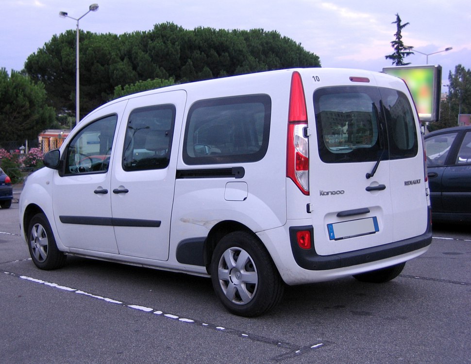 Rear three-quarter view of white van with sliding door and vertical taillights