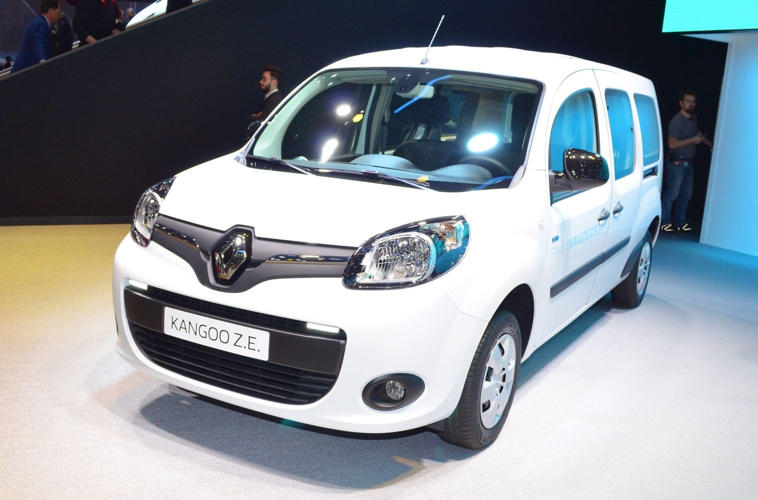 Front view of electric van with headlights and grille
