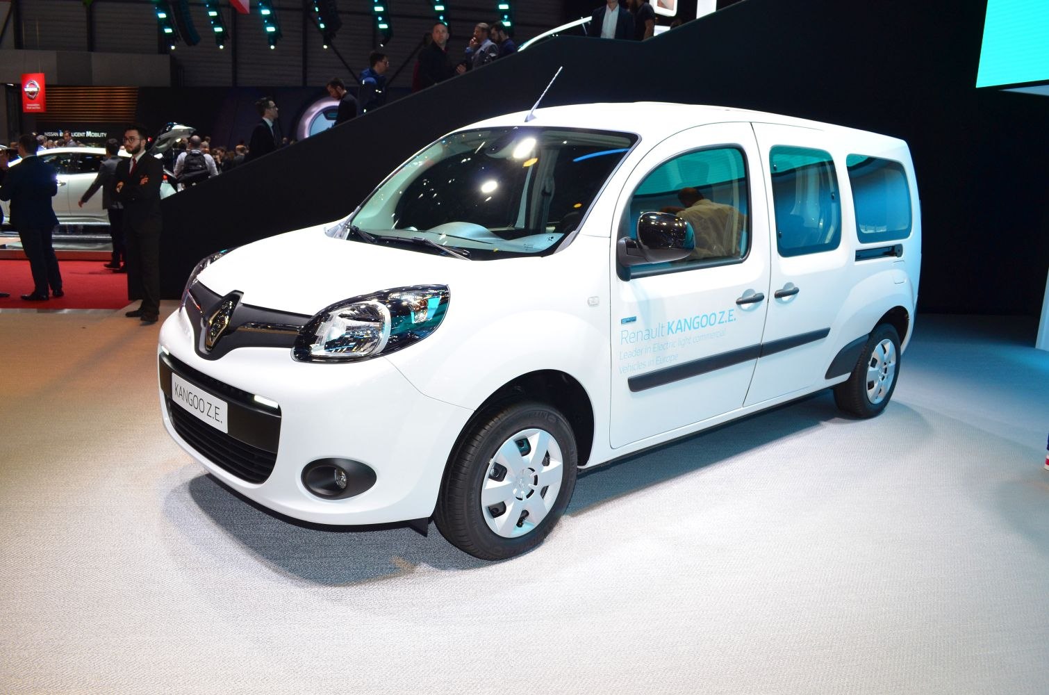 Front-side view of white compact electric van with distinctive headlights