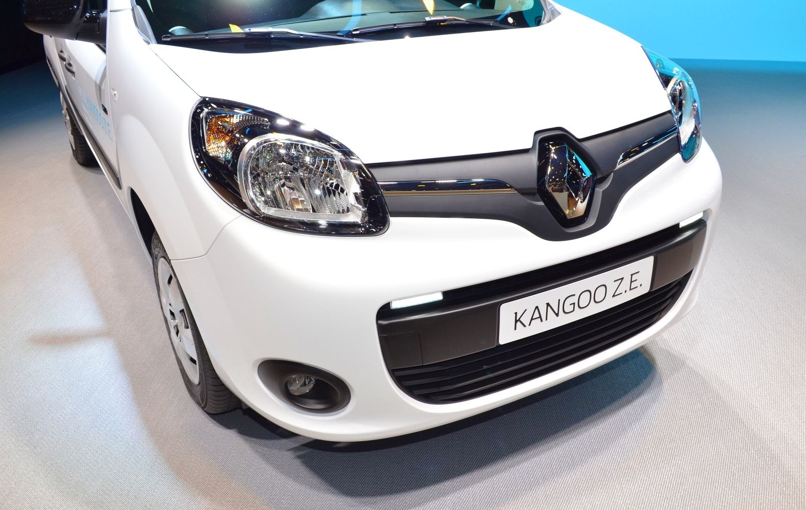 Front fascia with headlight, grille, and emblem