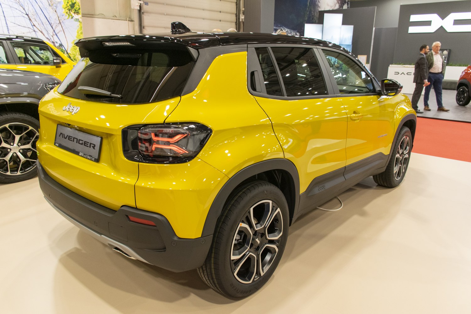 Rear and side view of SUV with unique taillights and two-tone paint.