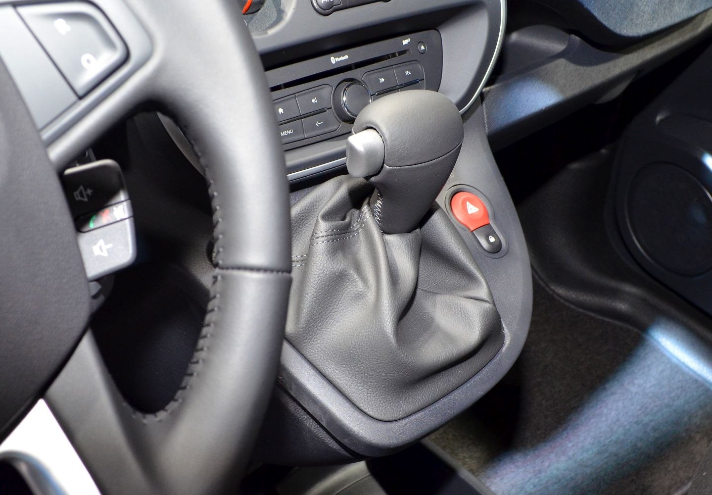 Gear shift lever with control buttons near steering wheel