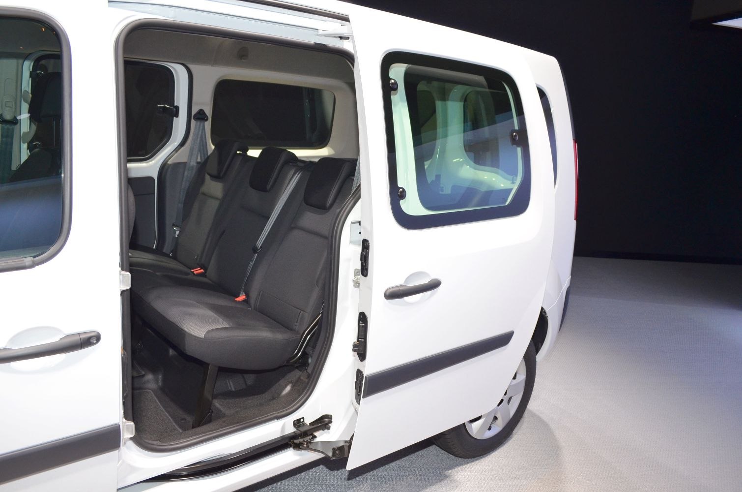 Open sliding door with visible rear passenger seats inside a van