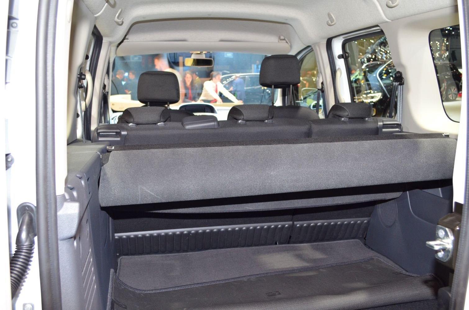 Spacious rear cargo area with foldable seats and protective cover