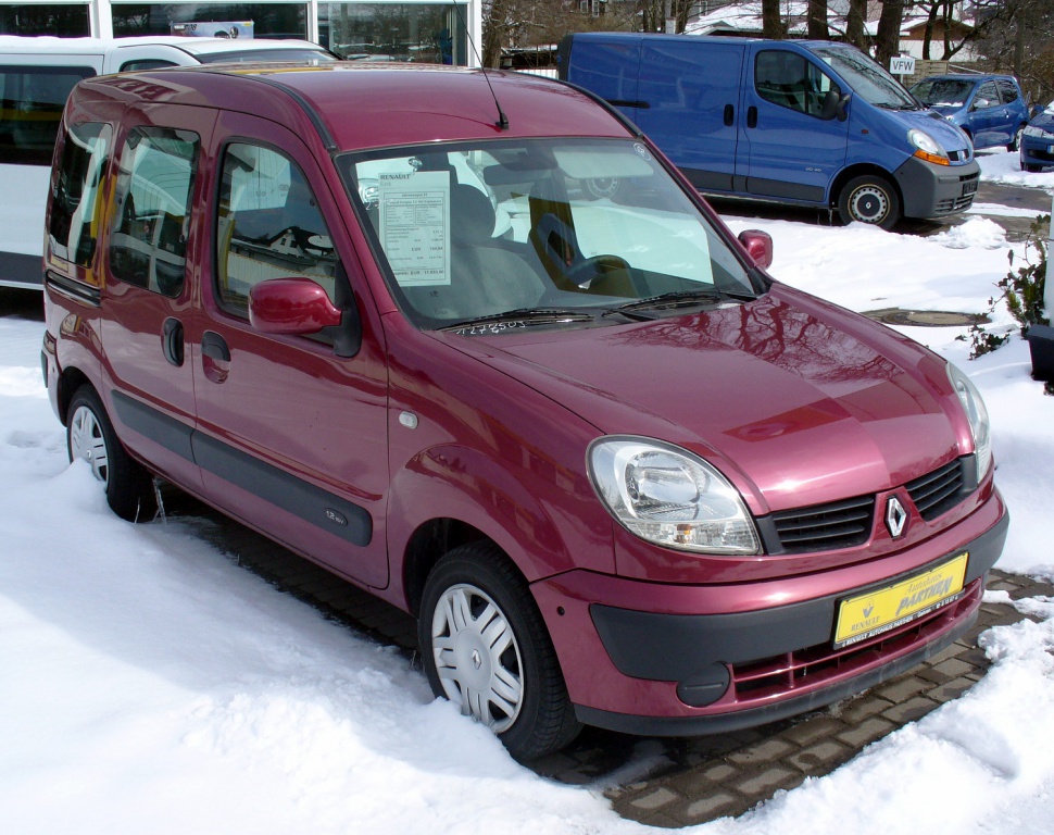 Compact multi-door van in burgundy with distinctive headlight and grille design