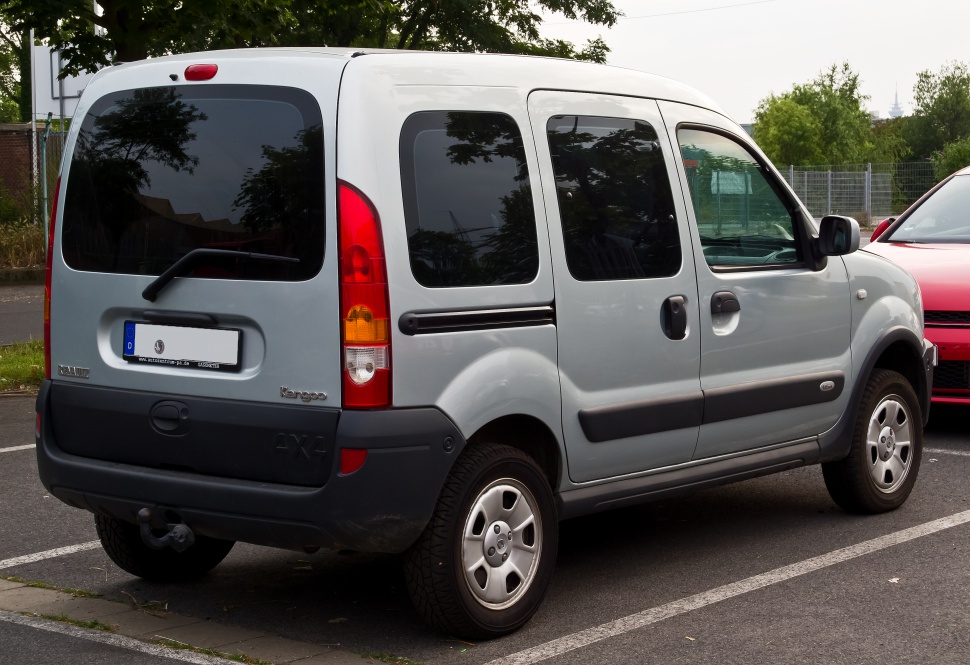 Rear side view of compact silver van with tinted windows