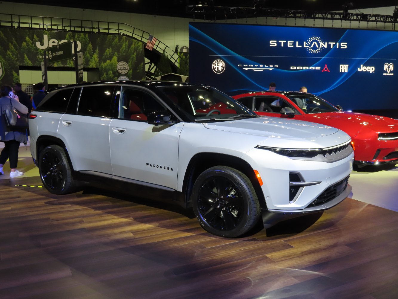 Sleek white SUV with black roof, LED headlights, and black wheels