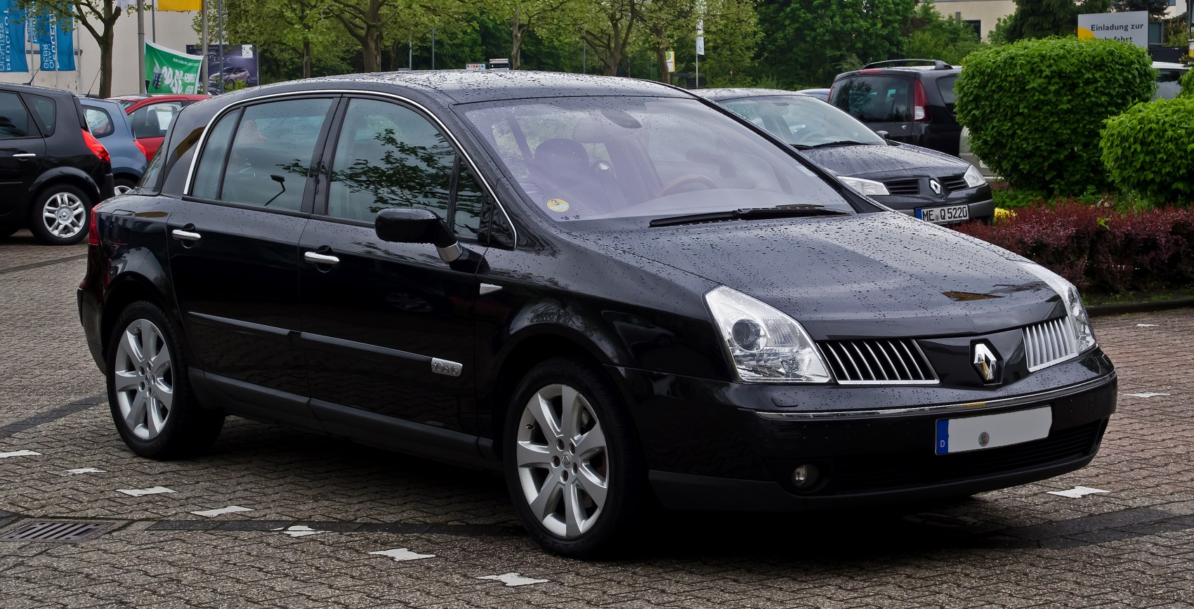 Luxury sedan front side view with angular headlights and distinctive grille