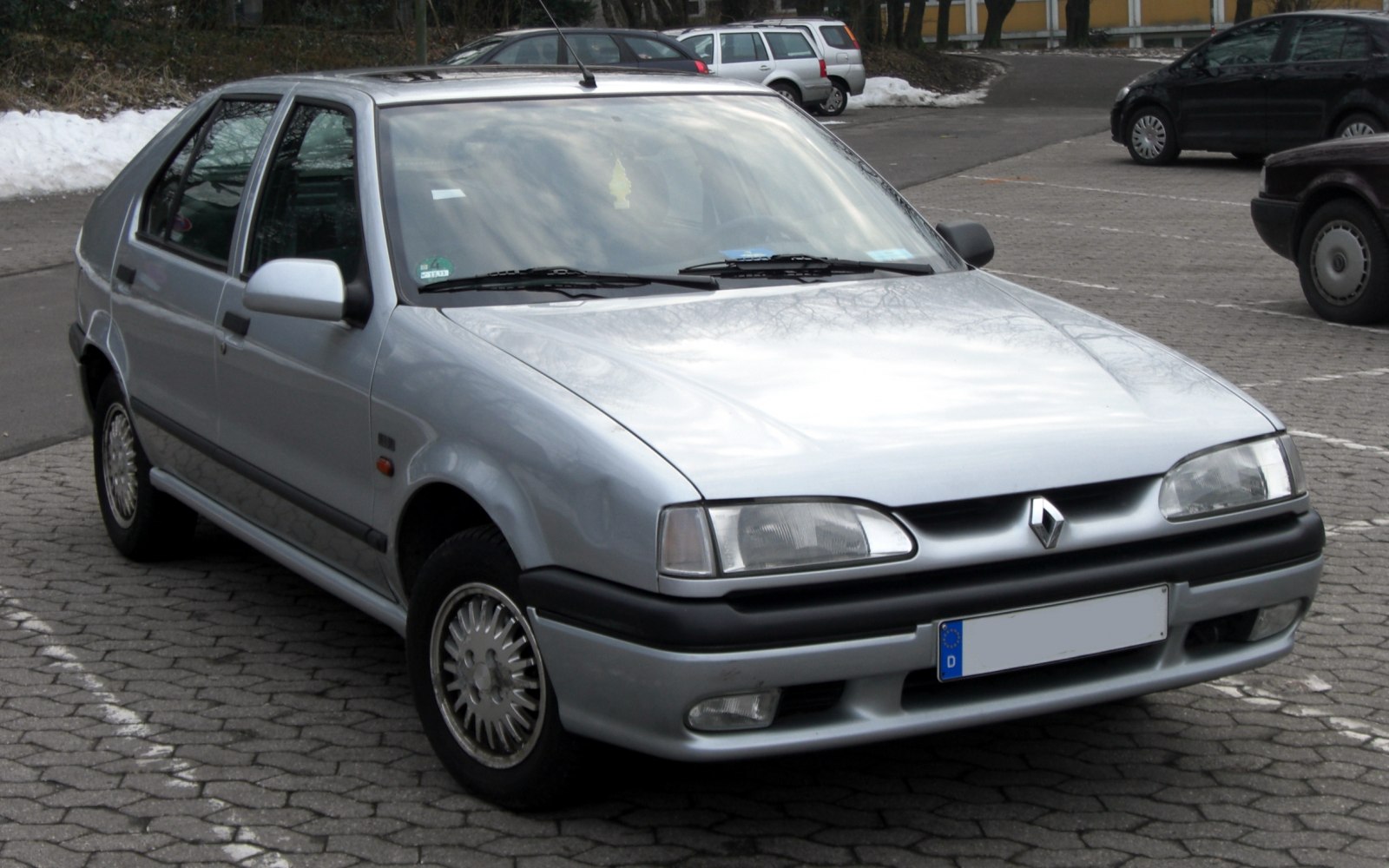 Silver silver hatchback front view with headlights and alloy wheels