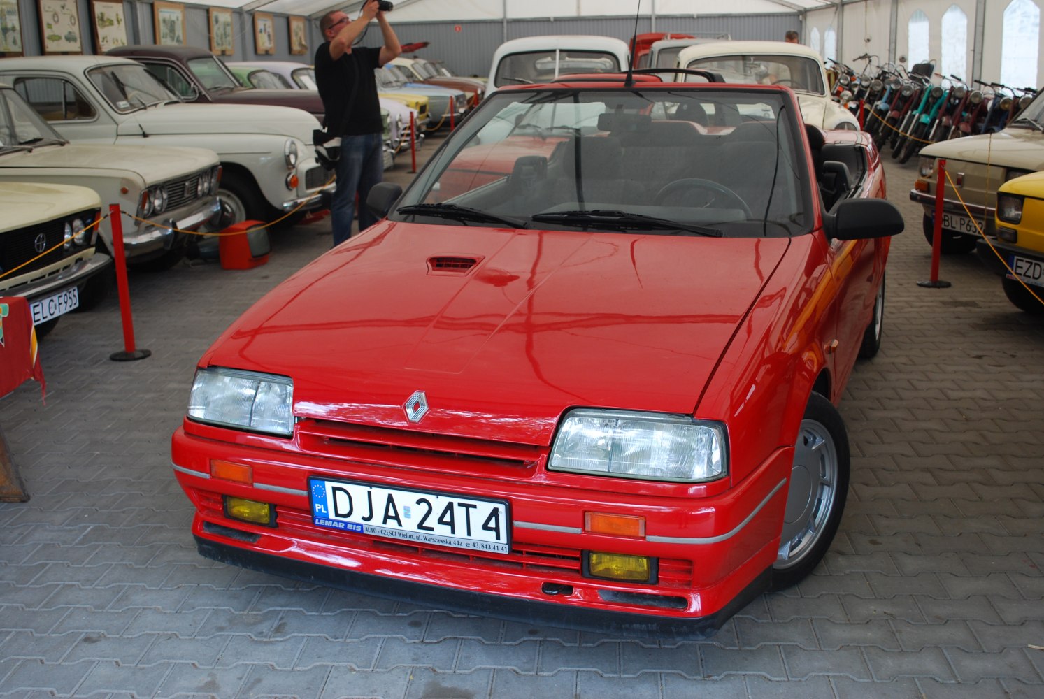 Red convertible with distinct front grille and headlights