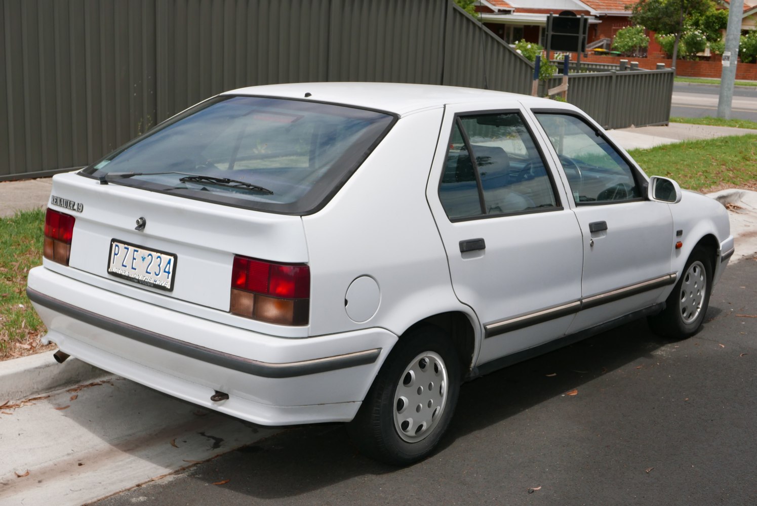 Rear three-quarter view of a classic 1988-1992 small hatchback with distinctive tail lights and wheels.