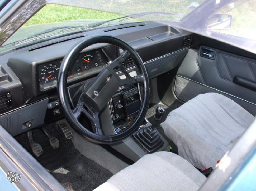 Classic dashboard and manual gearstick of 1980s car interior