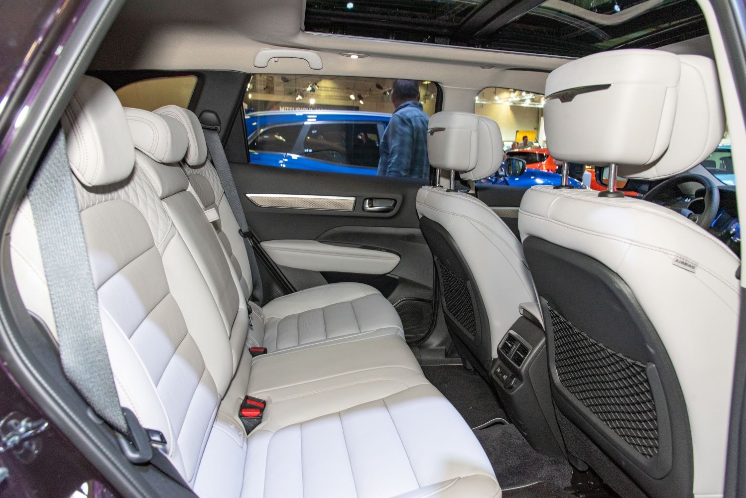 Rear interior with white leather seats and rear air vents