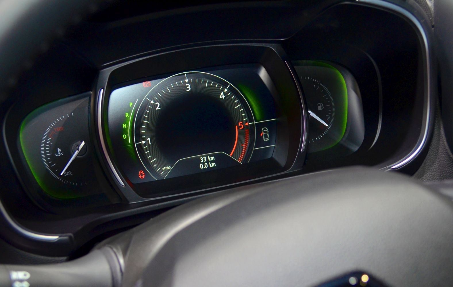 Digital instrument cluster with RPM, fuel, and temperature gauges