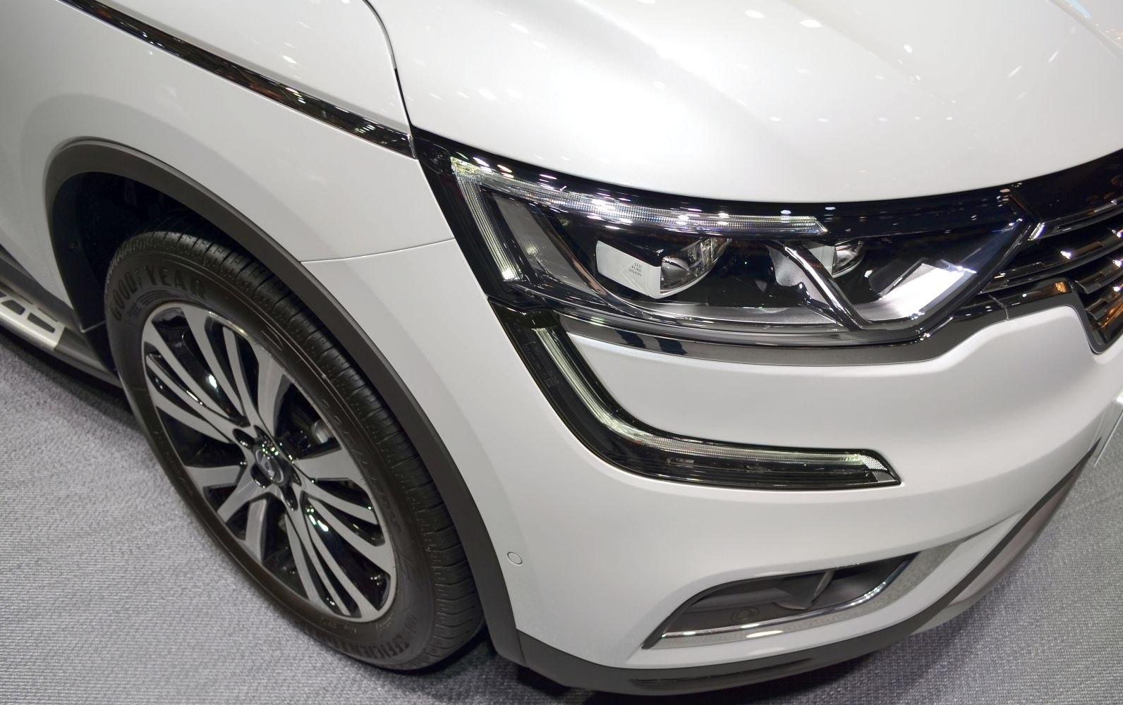 Front wheel with alloy rim and LED headlight design close-up