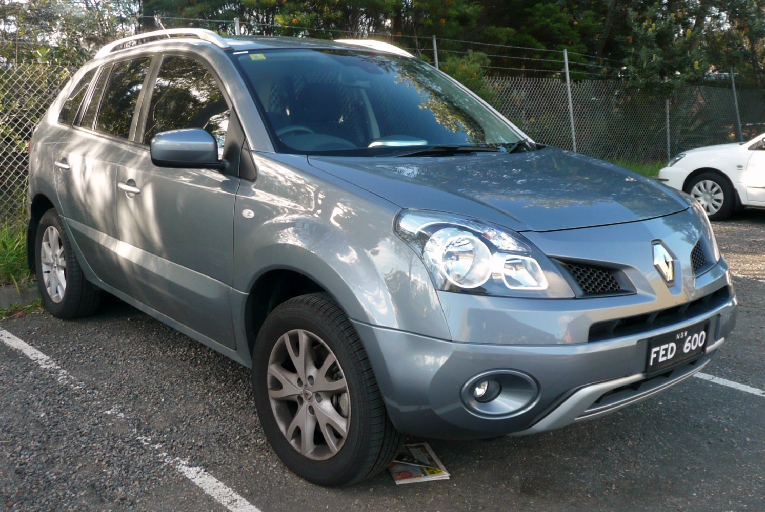 Front-side view of an SUV with roof rails and alloy wheels