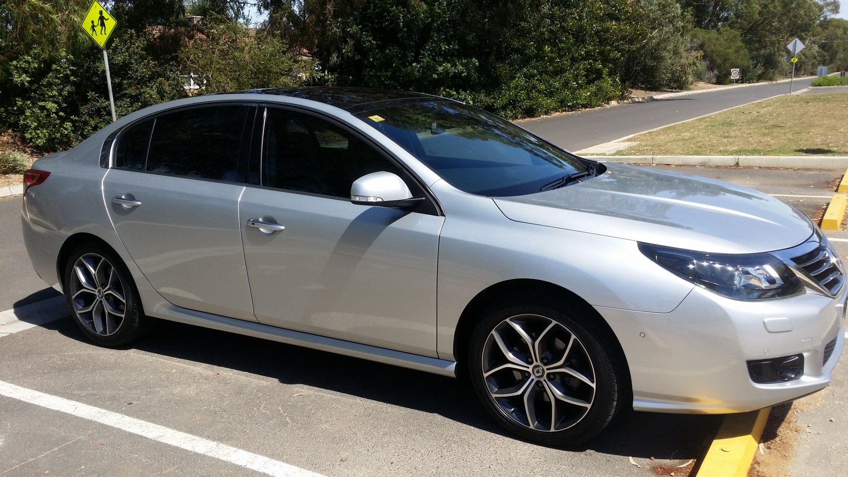 Silver sedan with modern alloy wheels and tinted windows