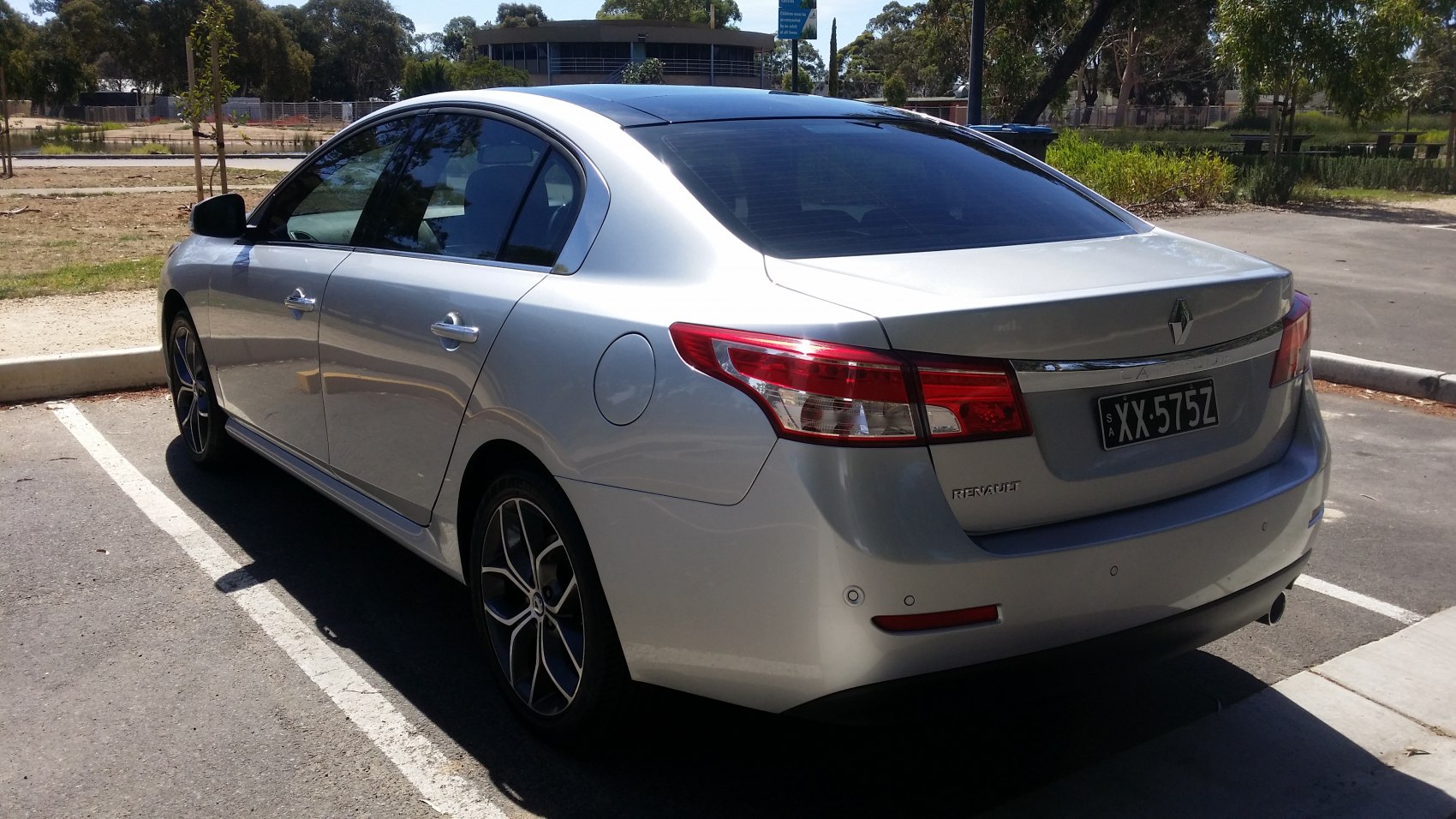 Rear view of sedan with modern taillights and alloy wheels