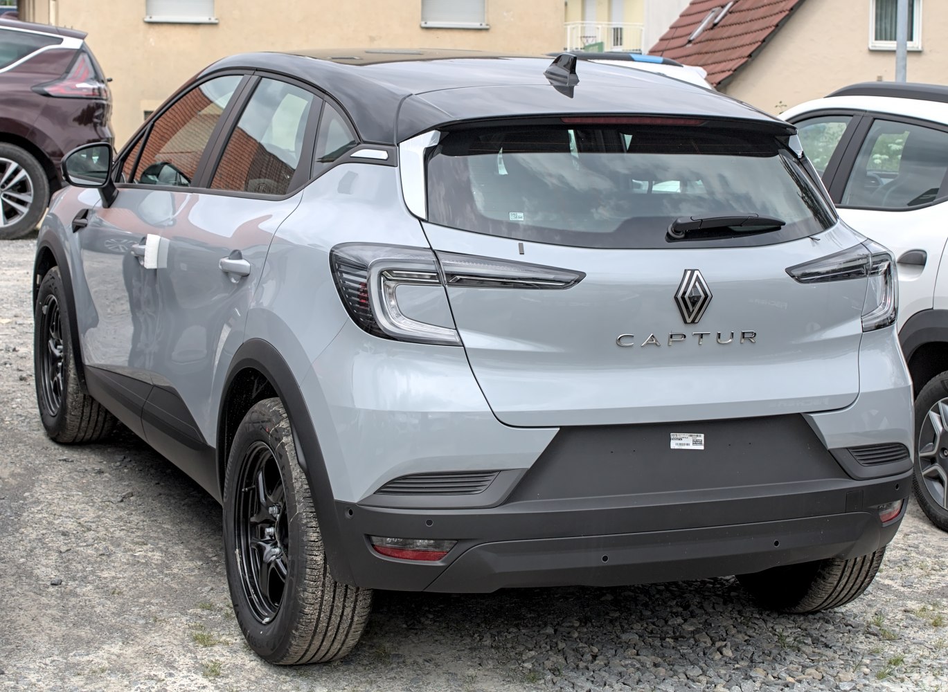 Rear view with distinctive taillights and black roof
