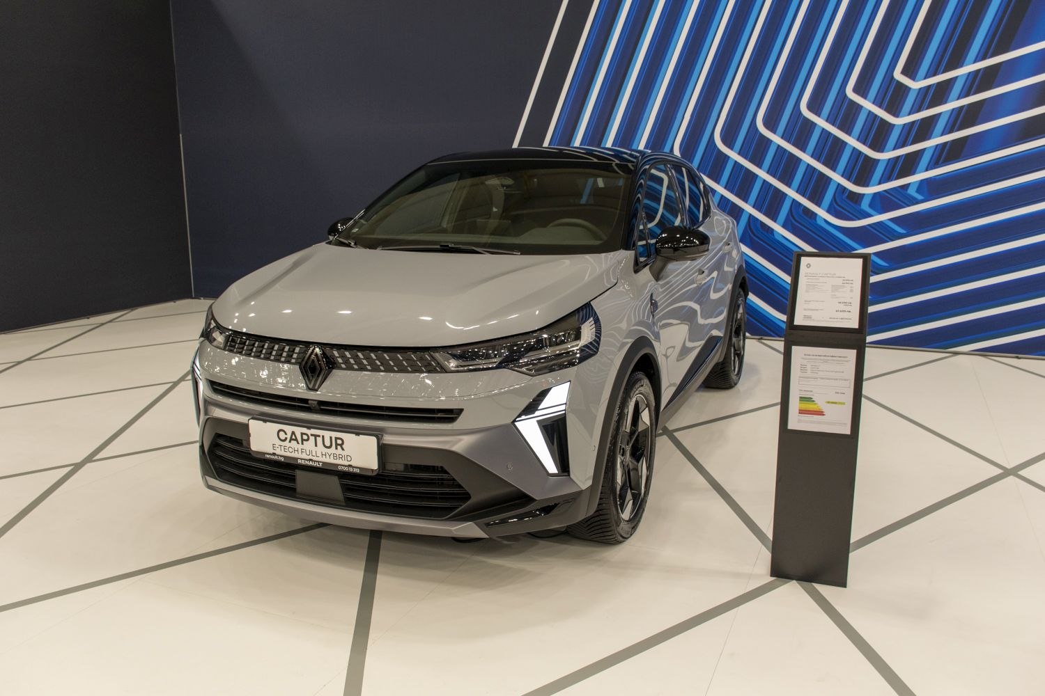 Front view of a modern hybrid compact crossover with LED daytime running lights.
