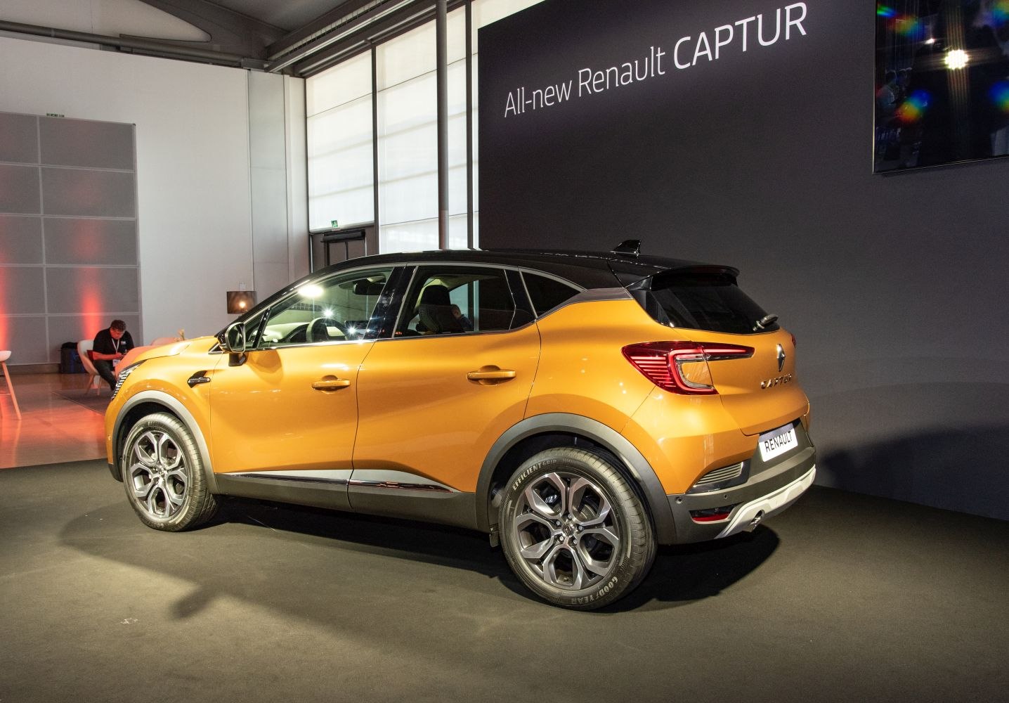Rear side profile with orange body and black roof