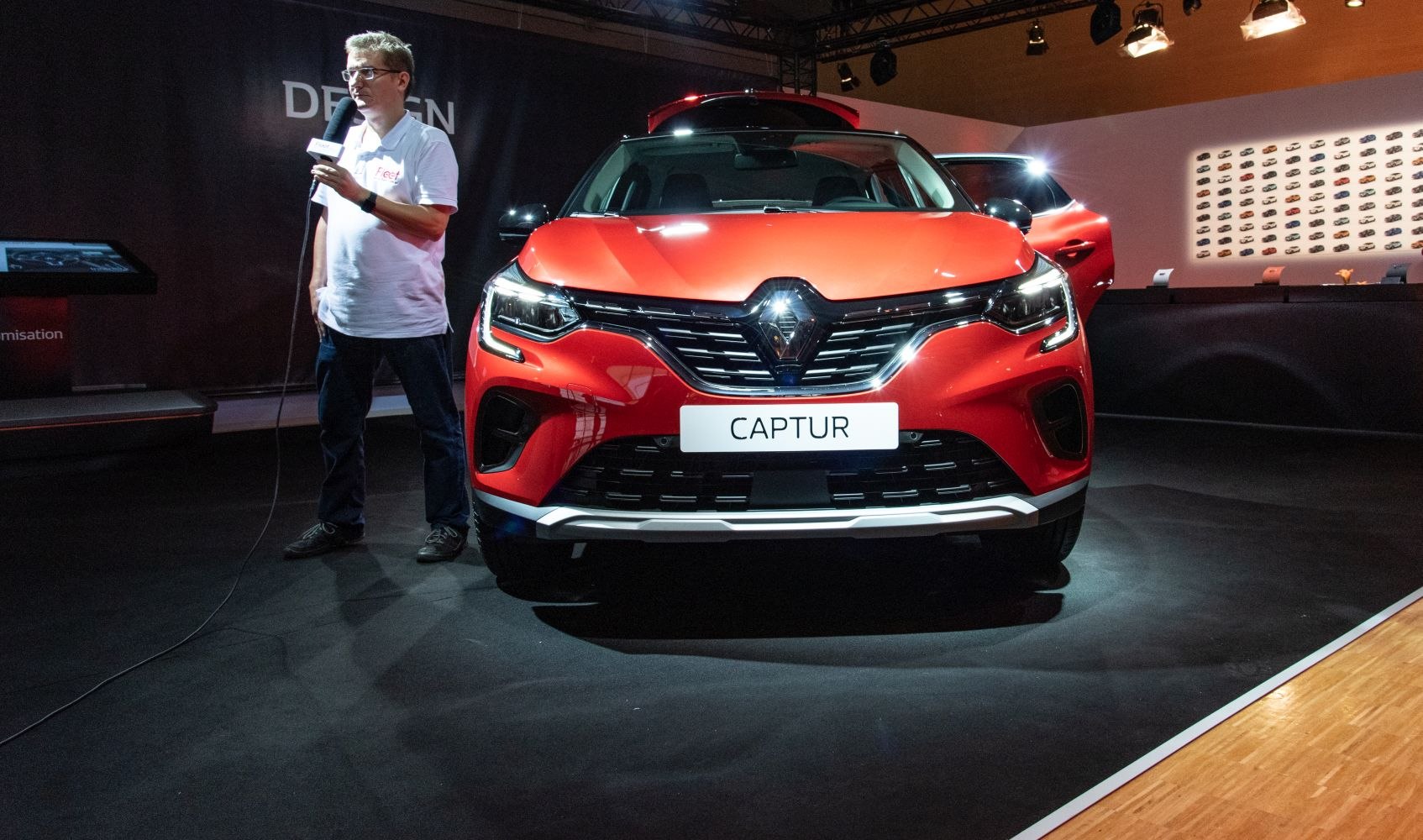 Front view of red SUV with grille and LED headlights