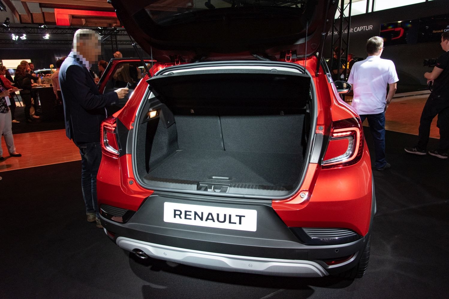 Open rear trunk with spacious cargo area and interior hatch layout