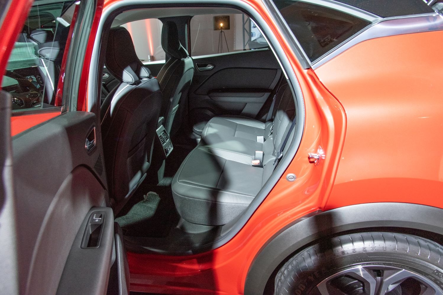 Spacious rear seating area with leather upholstery and door detail