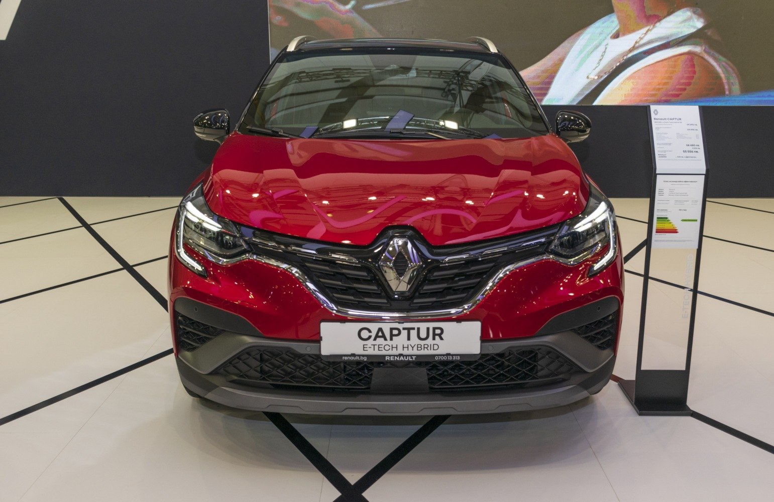 Front view with distinctive grille and LED headlights.