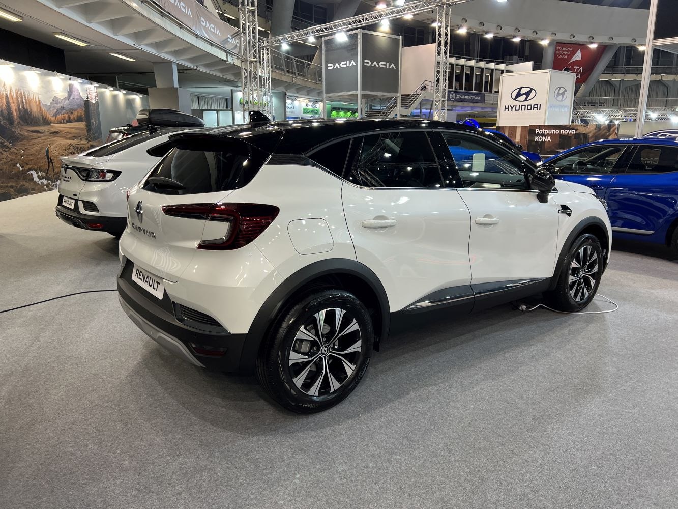 Rear and side view of compact SUV with two-tone roof and alloy wheels