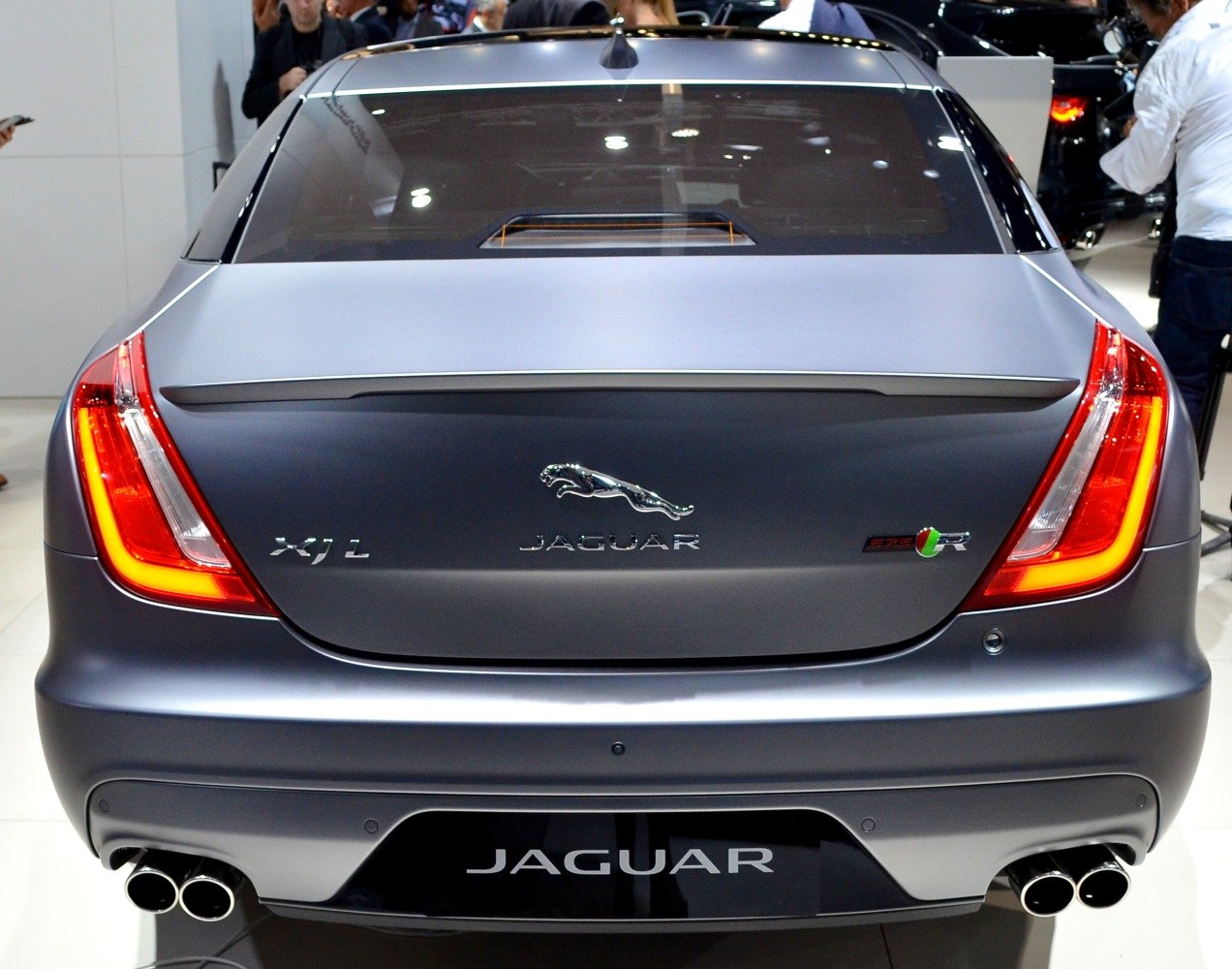 Jaguar luxury sedan rear with LED tail lights and quad exhaust tips