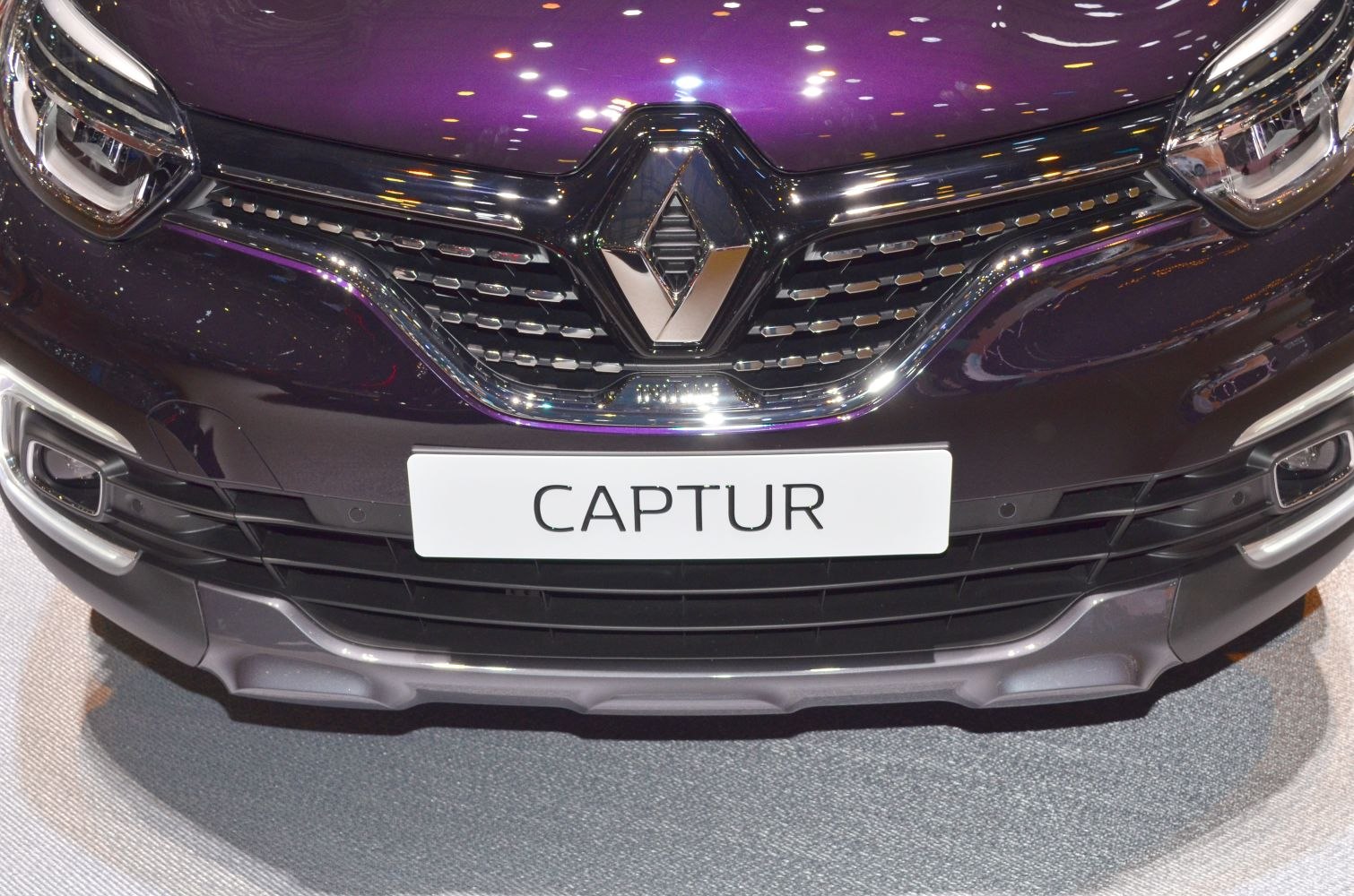 Close-up of front grille and headlights with chrome accents