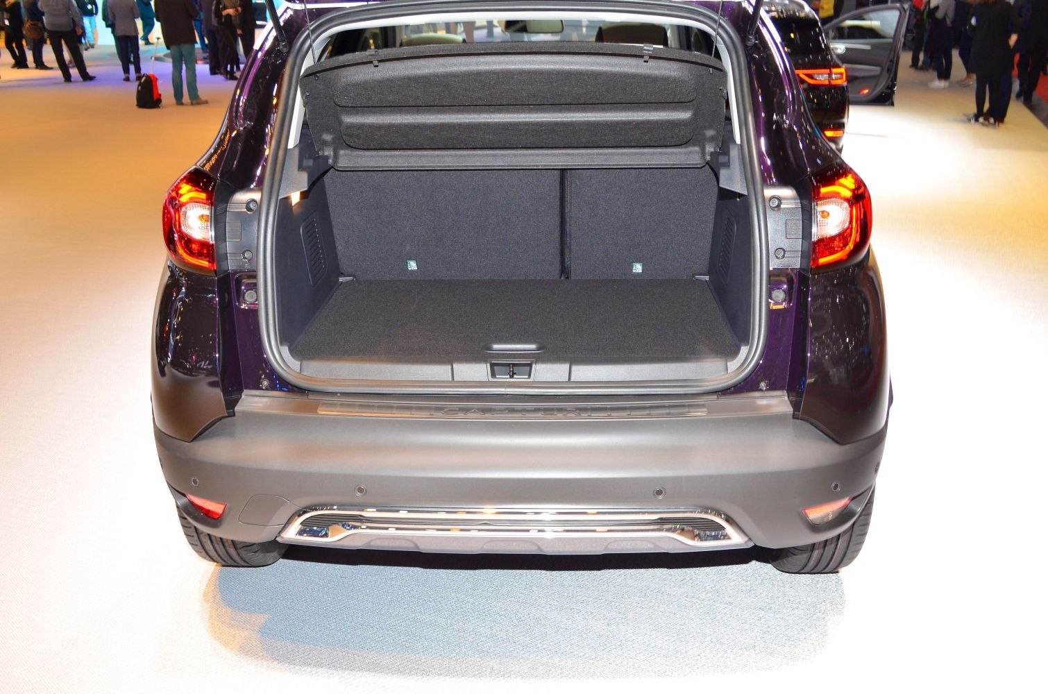 Spacious open trunk interior with rear hatch open and visible taillights