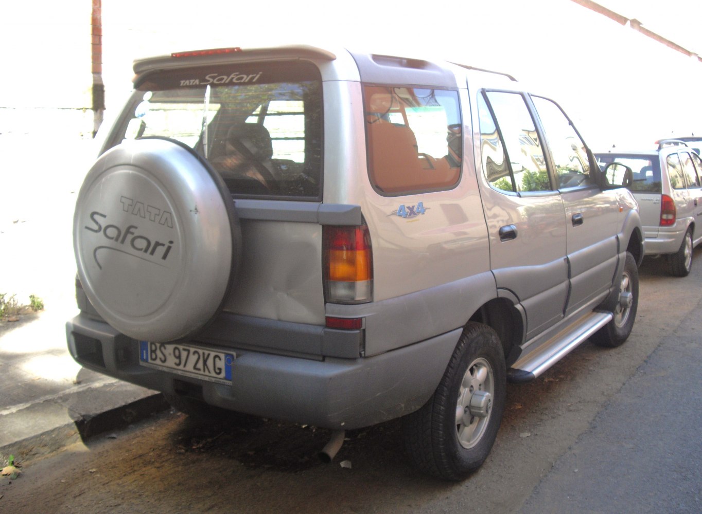 Rear side view of a 4x4 SUV with spare wheel cover