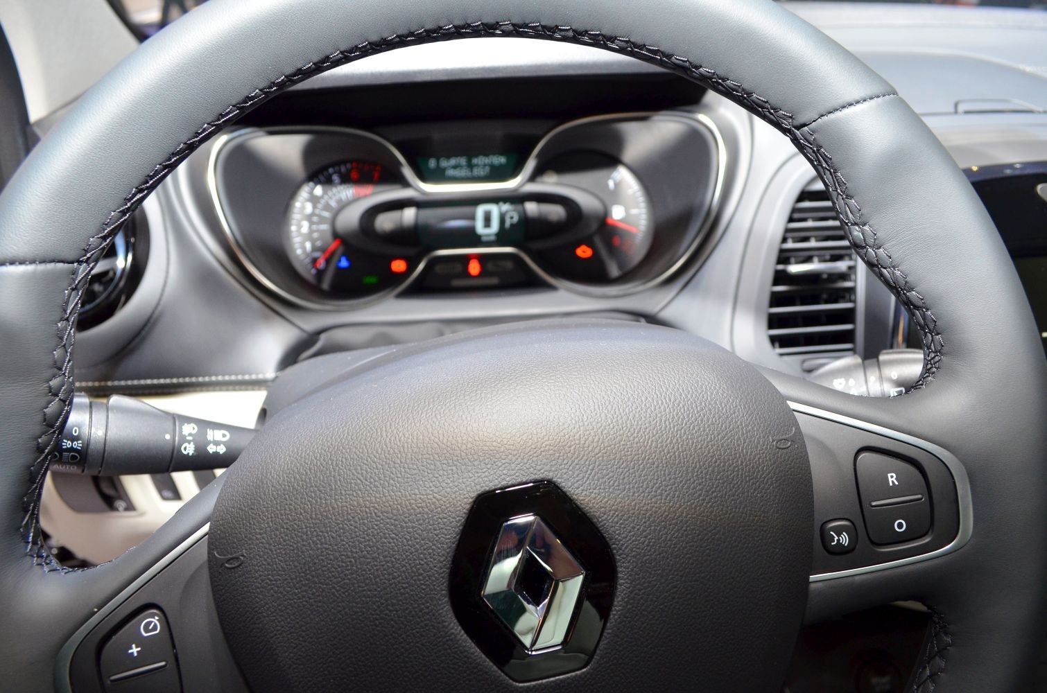 Steering wheel with stitched leather and digital instrument cluster