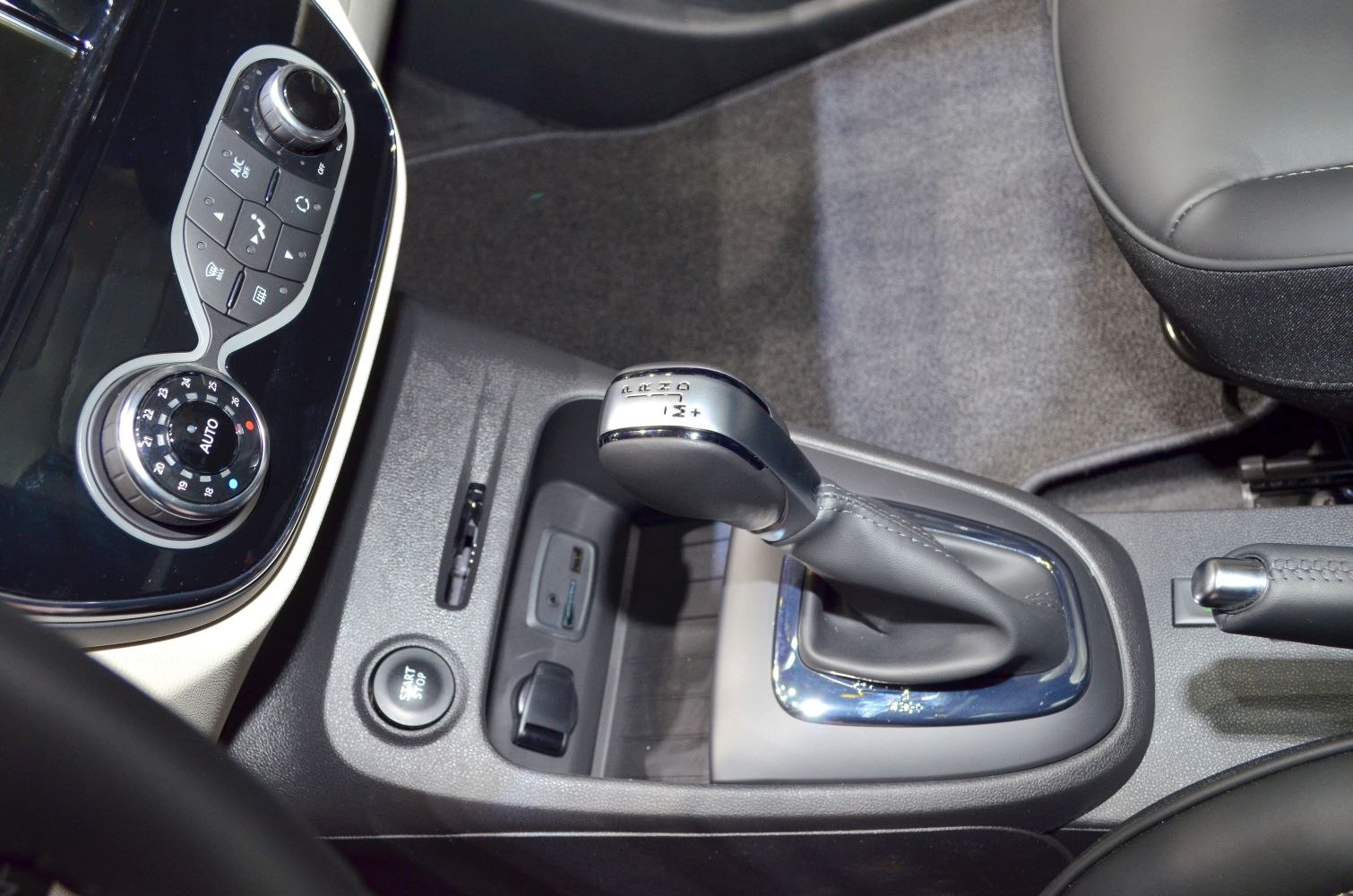 Automatic gear shift lever and climate control panel with start/stop button