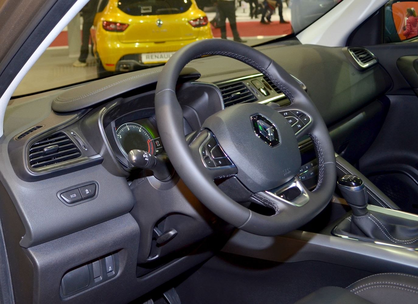Steering wheel and dashboard interior with gear shift and controls