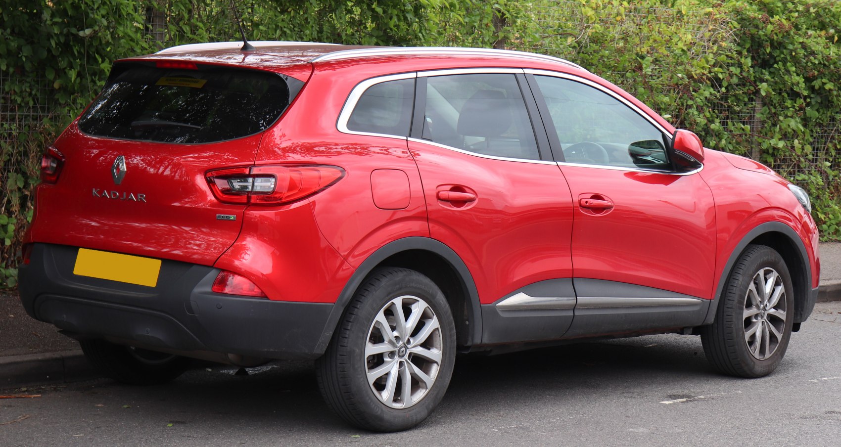 Rear-side view of red SUV with taillights and Eco2 badge