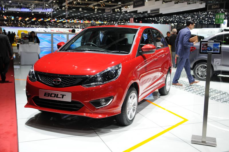 Red hatchback with sporty design and sleek headlights front angle view