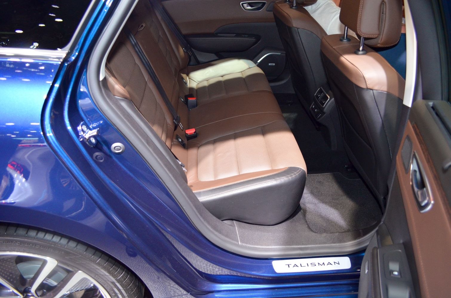 Rear seat interior with brown leather upholstery and spacious legroom