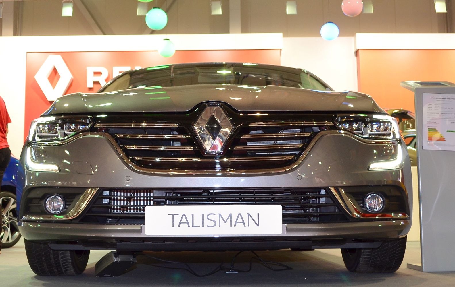 Front view with signature grille, LED headlights, and fog lights
