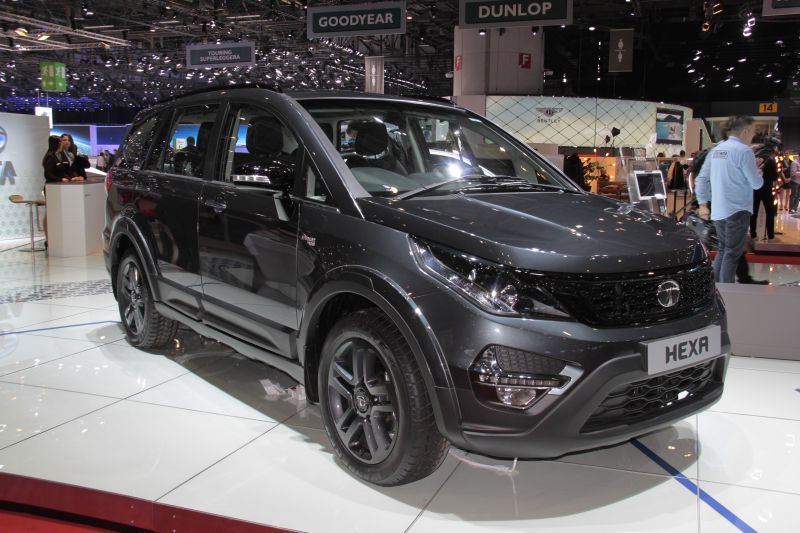 Front three-quarter view of SUV with black alloy wheels and sleek body