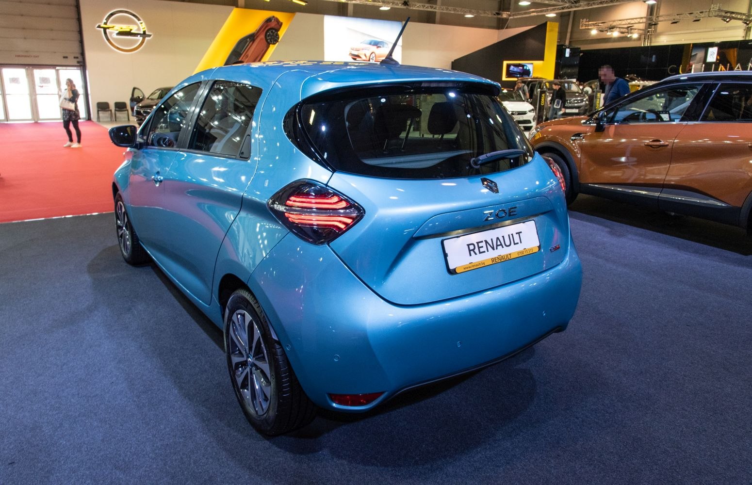 Rear view of electric hatchback with distinctive taillights and compact shape