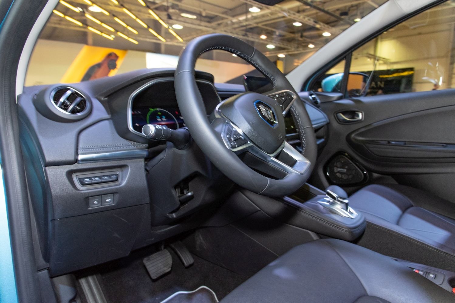 Steering wheel and dashboard with controls and gear shifter