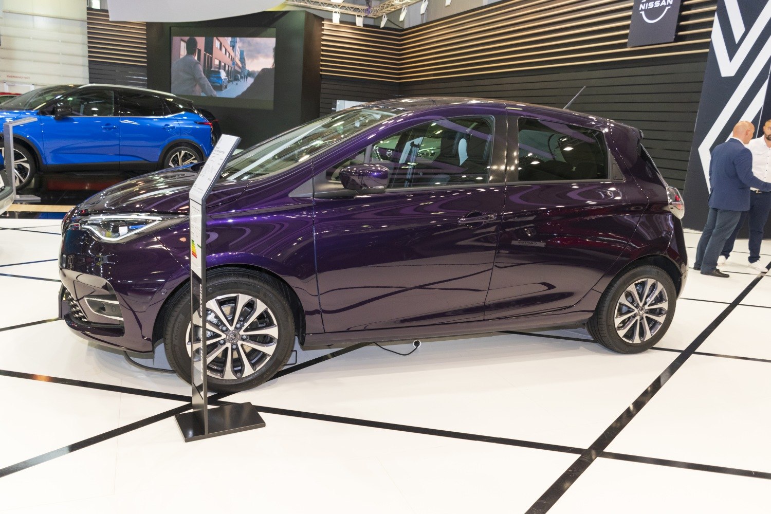 Side profile of compact electric hatchback with LED headlights and alloy wheels